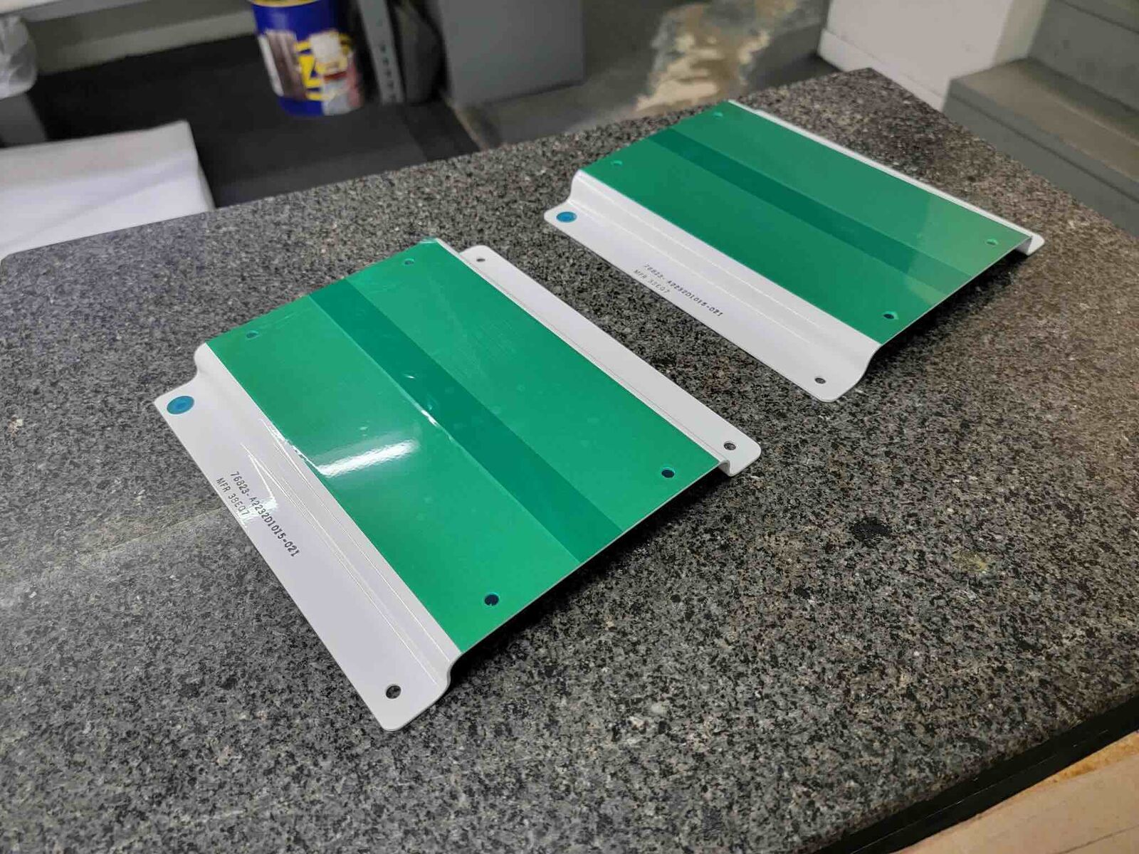 Pair of formed panels with green and white finish