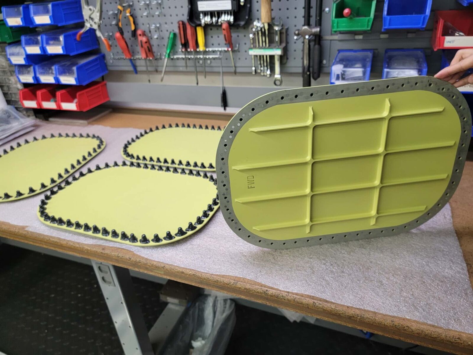 Coated yellow panels with fastener rings around the edges