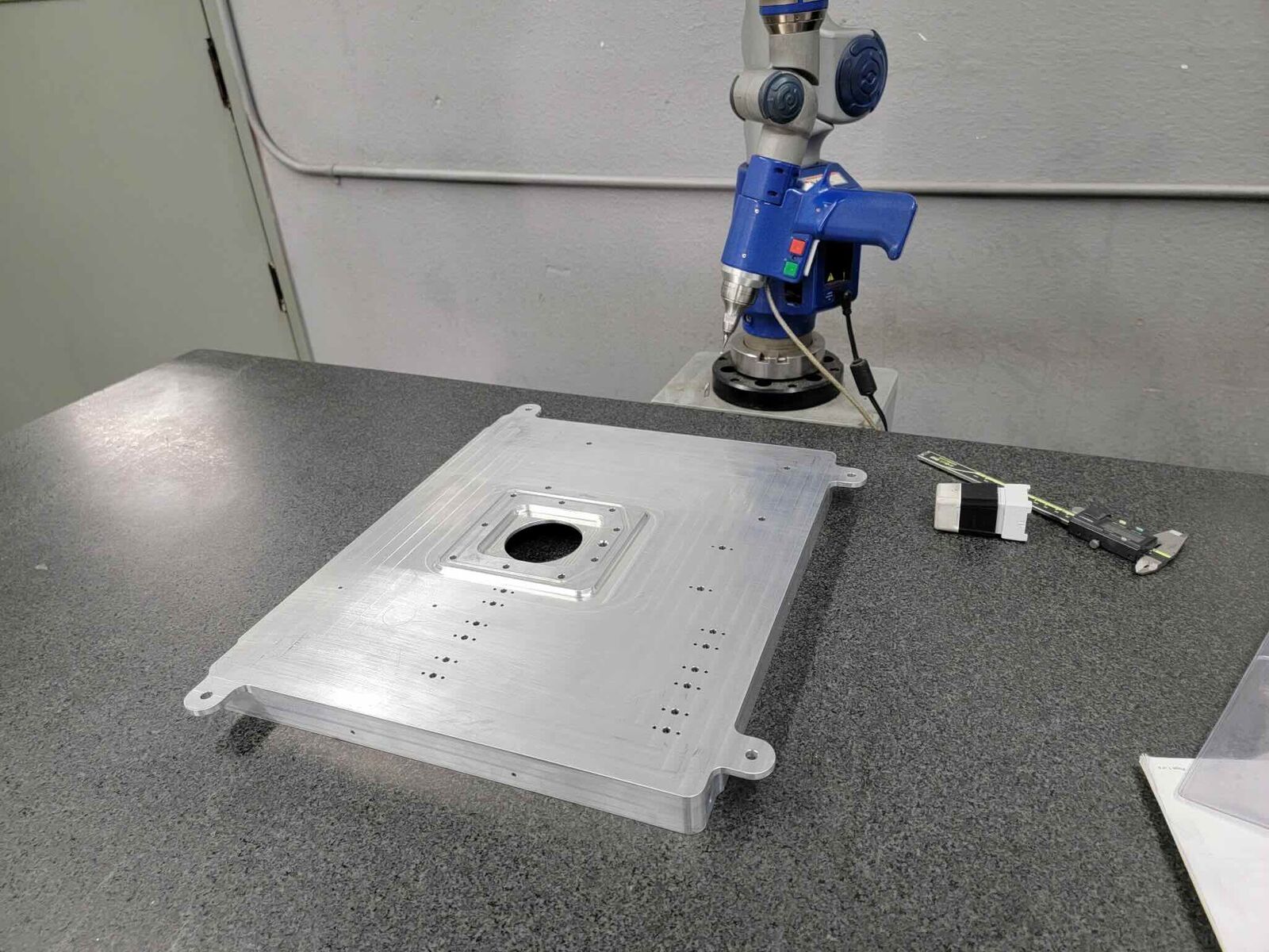 Machined plate measured with a CMM arm
