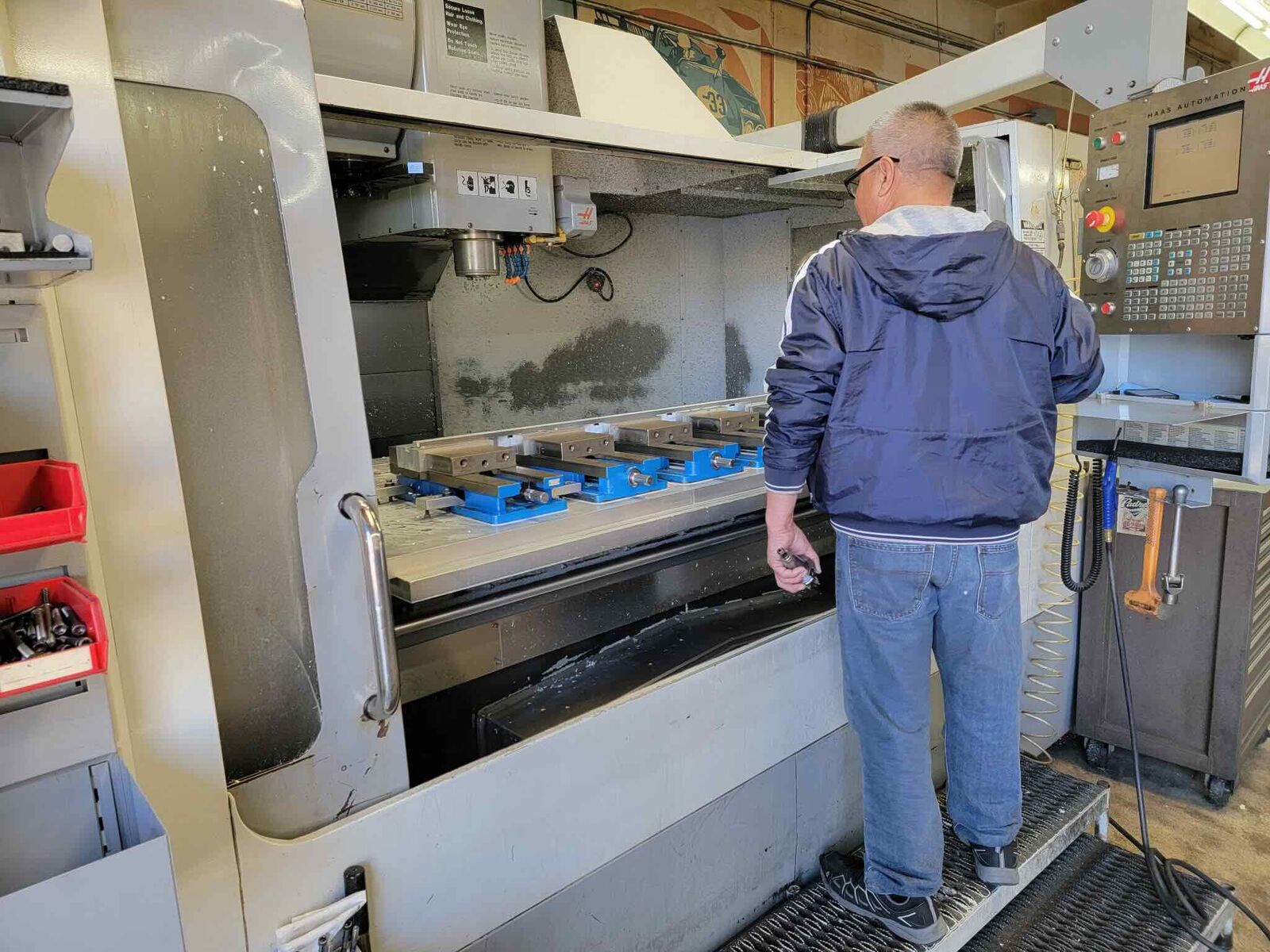 Machinist operating a CNC milling machine