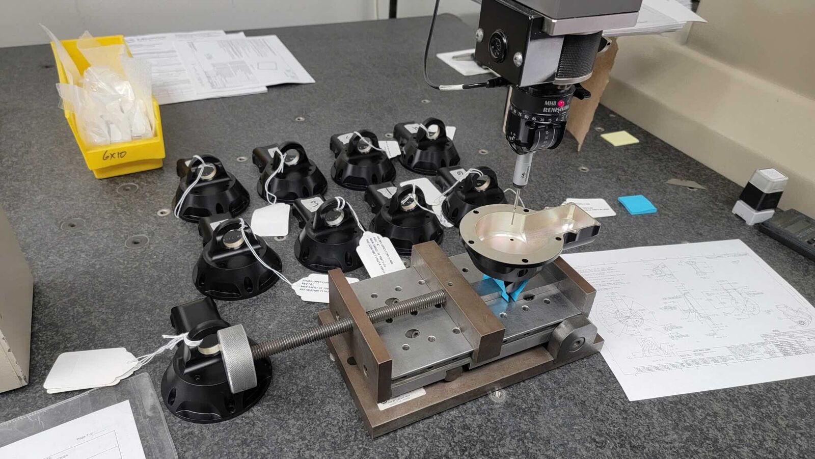 Small parts being inspected on a CMM with fixtures