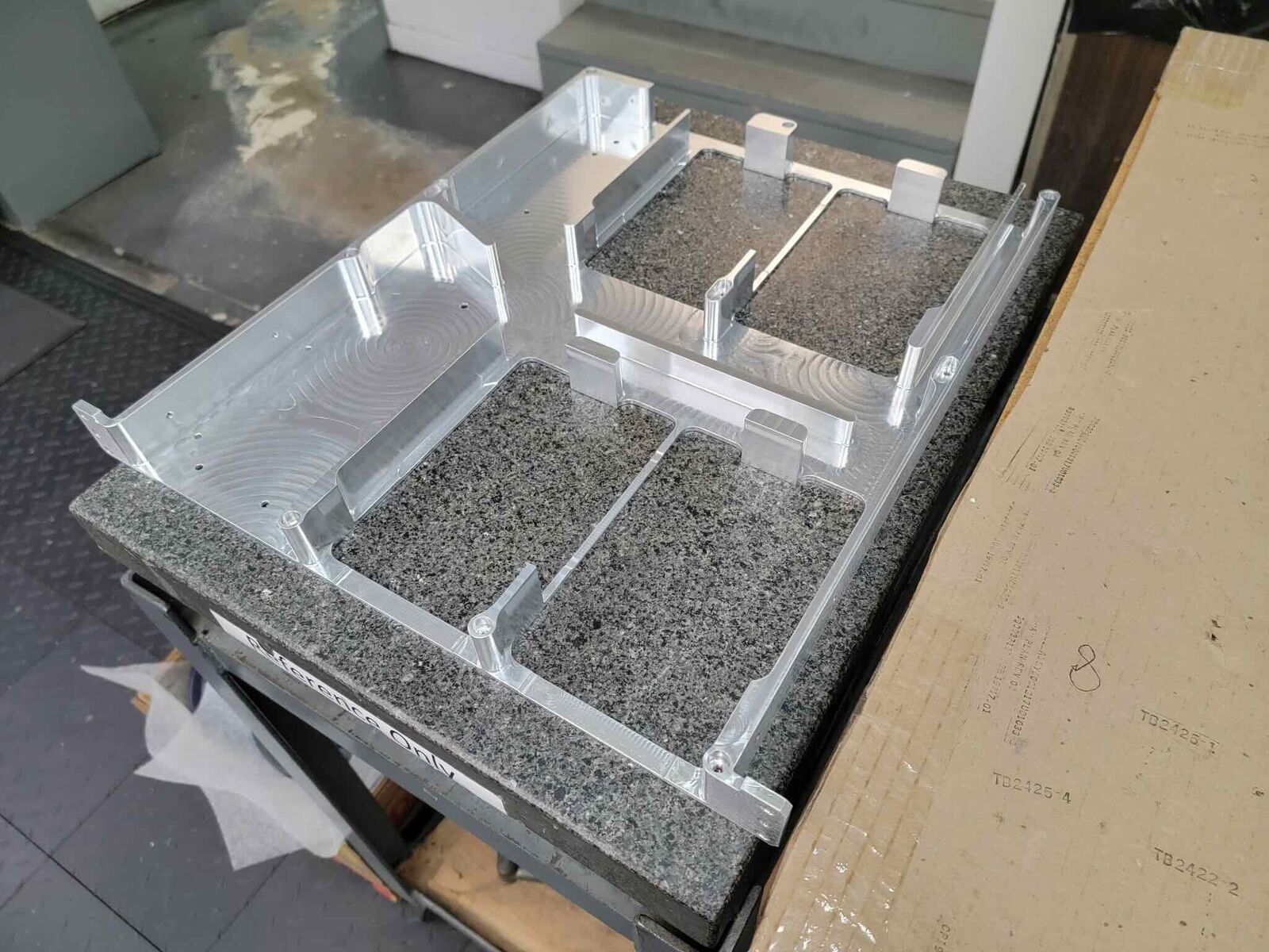 Machined aluminum housing with pockets